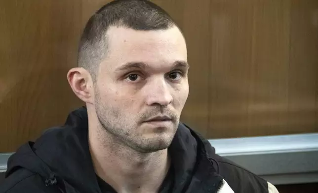 FILE - U.S. Army Staff Sgt. Gordon Black sits in a glass cage in courtroom in Vladivostok, Russia, on June 6, 2024. (AP Photo, File)