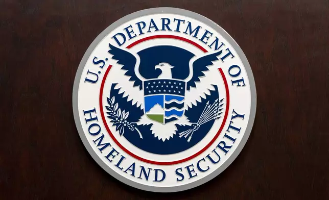 The Department of Homeland Security seal is seen on the podium at the Immigration and Customs Enforcement headquarters, Wednesday, April 9, 2025, in Washington. (AP Photo/Alex Brandon)