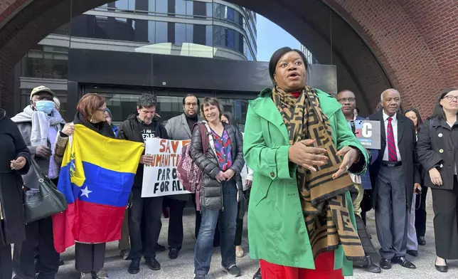 Immigration advocates speak Thursday, April 10, 2025, outside federal court in Boston, after a hearing aiming to halt the Trump administration's from stopping a program that allowed hundreds of thousands of Cubans, Haitians, Nicaraguans, and Venezuelans to temporarily live in the country. (AP Photos/Michael Casey)