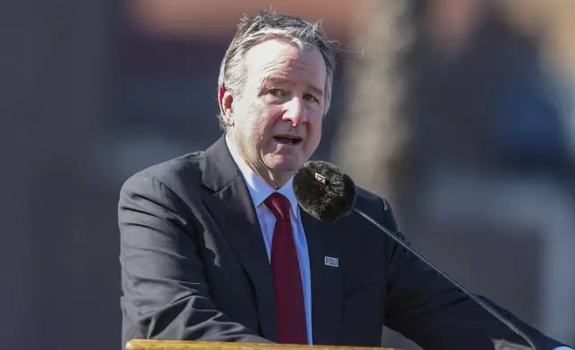 The day after an active shooter on campus Florida State president Richard McCullough addresses a vigil on campus at Langford Green, Tallahassee, Fla., Friday, April 18, 2025. (AP Photo/Gary McCullough)