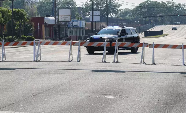 The Florida State University Student Union building and surrounding roads are blocked by law enforcement vehicles, Tallahassee, Fla., Thursday, April 17, 2025. (AP Photo/Gary McCullough)