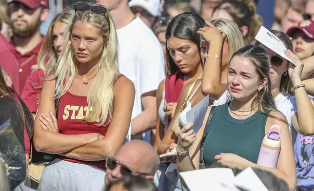 The day after an active shooter on campus Florida State held a vigil on campus at Langford Green, Tallahassee, Fla., Friday, April 18, 2025. (AP Photo/Gary McCullough)