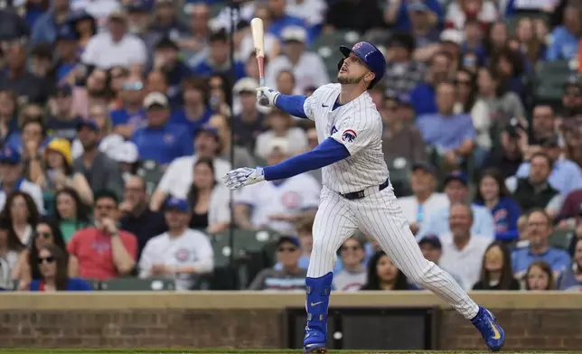 Chicago Cubs' Kyle Tucker (30) hits a single during the first inning of a baseball game against the Arizona Diamondbacks, Friday, April 18, 2025, in Chicago. (AP Photo/Erin Hooley)