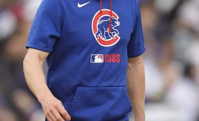 Chicago Cubs manager Craig Counsell walks to the mound to make a pitching change during the fifth inning of a baseball game against the Arizona Diamondbacks, Friday, April 18, 2025, in Chicago. (AP Photo/Erin Hooley)