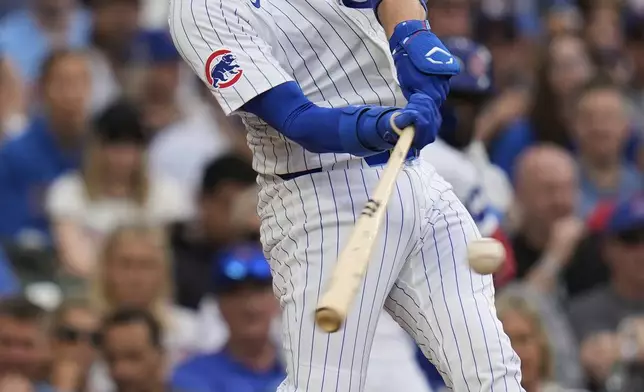 Chicago Cubs' Carson Kelly (15) hits a two-run home run during the second inning of a baseball game against the Arizona Diamondbacks, Friday, April 18, 2025, in Chicago. (AP Photo/Erin Hooley)