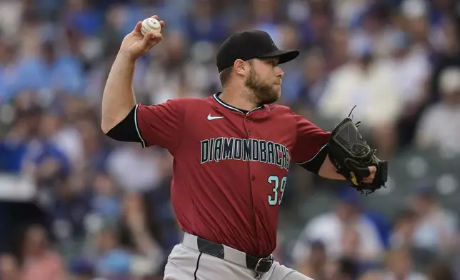 Arizona Diamondbacks starting pitcher Corbin Burnes (39) throws against the Chicago Cubs, during the first inning of a baseball game Friday, April 18, 2025, in Chicago. (AP Photo/Erin Hooley)