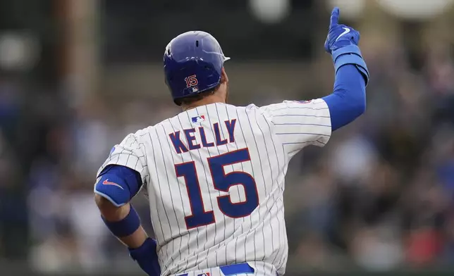 Chicago Cubs' Carson Kelly (15) runs the bases after hitting a two-run home run during the second inning of a baseball game against the Arizona Diamondbacks, Friday, April 18, 2025, in Chicago. (AP Photo/Erin Hooley)