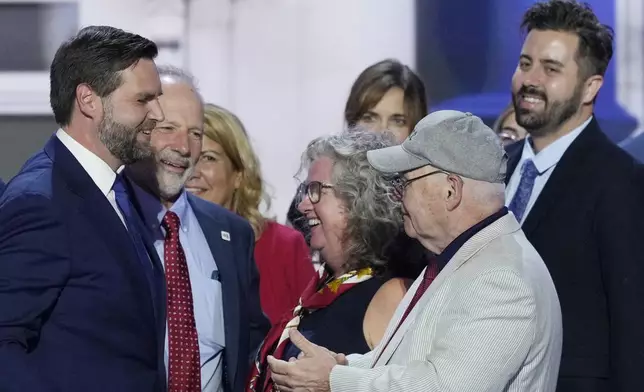 Cory Bowman, half-brother of Republican vice presidential candidate Sen. JD Vance, R-Ohio, top right, is pictured on stage with Vance, left, during the Republican National Convention, Wednesday, July 17, 2024, in Milwaukee. (AP Photo/J. Scott Applewhite)
