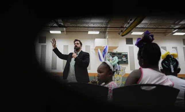 River Church Cincinnati pastor Cory Bowman, who is Vice President JD Vance's half brother and Cincinnati mayoral candidate, preaches during Easter worship service in the Hays Porter Elementary School gym Sunday, April 20, 2025, in Cincinnati. (AP Photo/Carolyn Kaster)