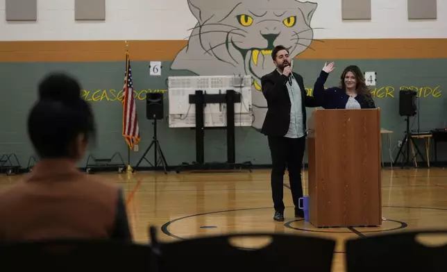 River Church Cincinnati founding pastors Cory and Jordan Bowman preach during Easter worship service in the Hays Porter Elementary School gym Sunday, April 20, 2025, in Cincinnati. Vice President JD Vance's half-brother Cory Bowman is running for Cincinnati Mayor. (AP Photo/Carolyn Kaster)