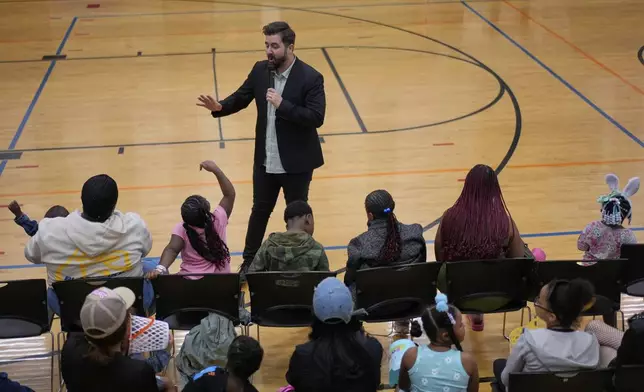 River Church Cincinnati pastor Cory Bowman, who is Vice President JD Vance's half brother and Cincinnati mayoral candidate, preaches during Easter worship service in the Hays Porter Elementary School gym Sunday, April 20, 2025, in Cincinnati. (AP Photo/Carolyn Kaster)