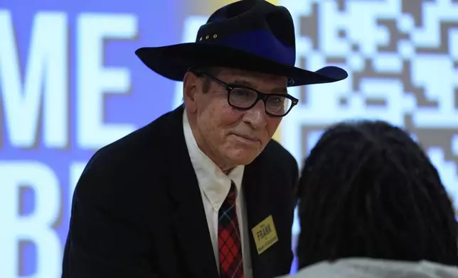 Cincinnati mayoral candidate Brian Frank talks with a person in the audience after participating in a candidate forum with Cincinnati Mayor Aftab Pureval, hosted by the Cincinnati NAACP, Tuesday, April 15, 2025, in Cincinnati.(AP Photo/Carolyn Kaster)