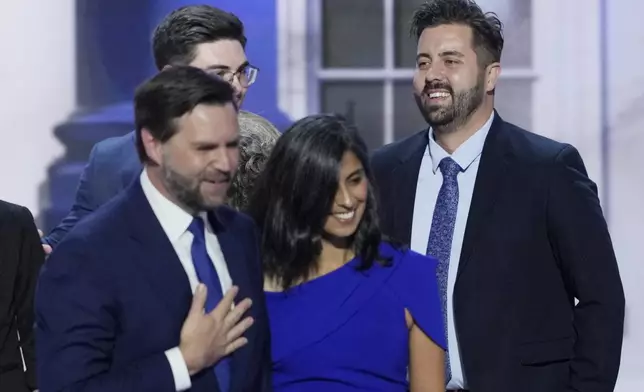 Cory Bowman, half-brother of Republican vice presidential candidate Sen. JD Vance, R-Ohio, from right, is pictured on stage with Usha Vance and JD Vance during the Republican National Convention, Wednesday, July 17, 2024, in Milwaukee. (AP Photo/J. Scott Applewhite)