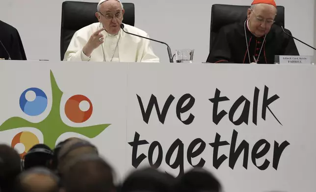 FILE - Pope Francis, left, flanked by Cardinal Kevin Farrell, delivers a speech at the Mater Ecclesiae college in Rome, March 19, 2018. (AP Photo/Alessandra Tarantino, File)