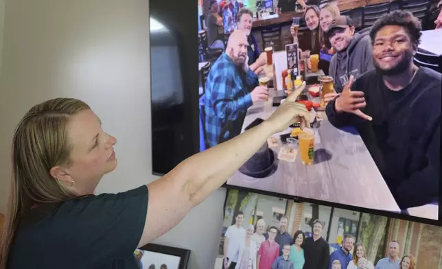 FILE - Rebecca Higbee the mother of Tyler Thompson, points to her son and his friend Marcel during his 21st birthday with his family on May 30, 2024, in West Jordan, Utah. (AP Photo/Rick Bowmer, File)