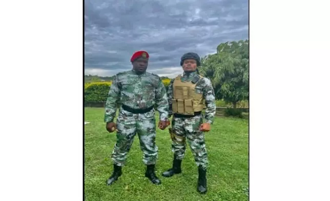 In this unknown location and date image released by the U.S. Dept. of Justice, Christian Malanga, left, and Marcel Malanga can be seen wearing military-style uniforms which was posted to social media on Jan. 6, 2024. (U.S. Dept. of Justice via AP)
