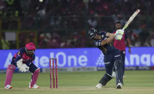 Gujarat Titans' Jos Butler plays a shot during the Indian Premier League cricket match between Rajasthan Royals and Gujarat Titans at Sawai Mansingh Stadium in Jaipur, India, Monday, April 28, 2025. (AP Photo/Surjeet Yadav)