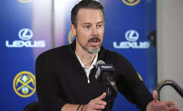 Denver Nuggets team president Josh Kroenke responds to questions at a news conference Monday, April 14, 2025, in Denver about the firing of the team's general manager and head coach last week. (AP Photo/David Zalubowski)