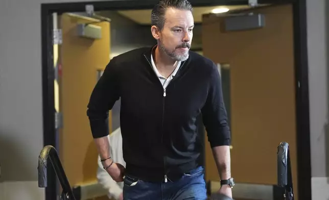 Denver Nuggets team president Josh Kroenke steps up to respond to questions at a news conference Monday, April 14, 2025, in Denver to questions about the firing of the team's general manager and head coach last week. (AP Photo/David Zalubowski)