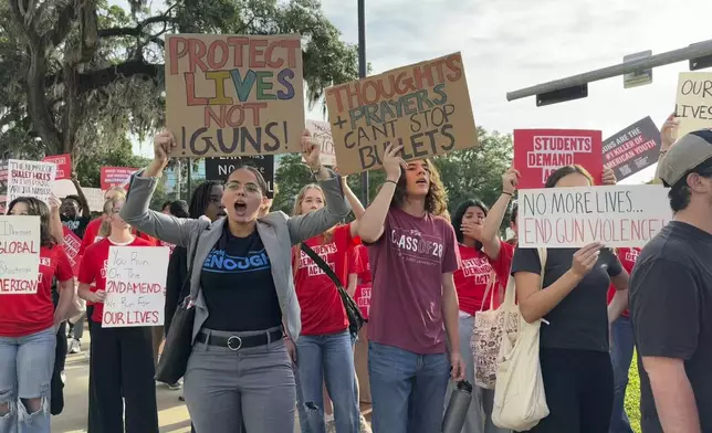 Students and activists rally for gun control policies outside of Florida's historic old capitol on Wednesday, April 23, 2025 in Tallahassee, Fla., less than a week after a deadly shooting at Florida State University. (AP Photo/Kate Payne)
