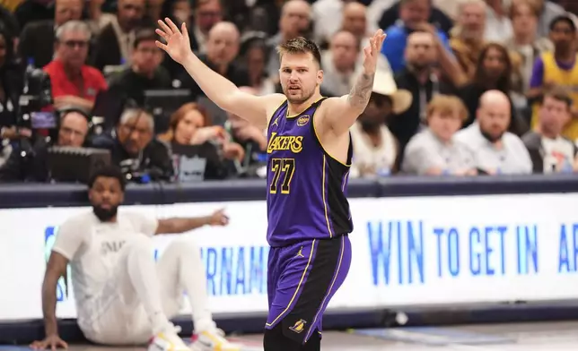 Los Angeles Lakers' Luka Doncic (77) reacts to play in the second half of an NBA basketball game against the Dallas Mavericks in Dallas, Wednesday, April 9, 2025. (AP Photo/LM Otero)