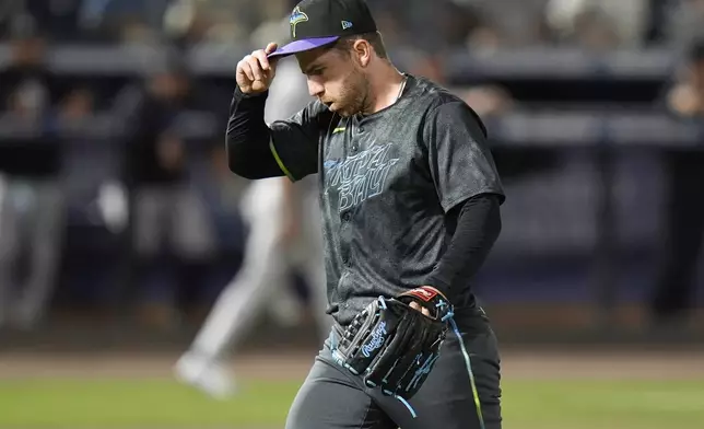 Tampa Bay Rays pitcher Hunter Bigge reacts after striking out New York Yankees' Anthony Volpe during the ninth inning of a baseball game Friday, April 18, 2025, in Tampa, Fla. (AP Photo/Chris O'Meara)