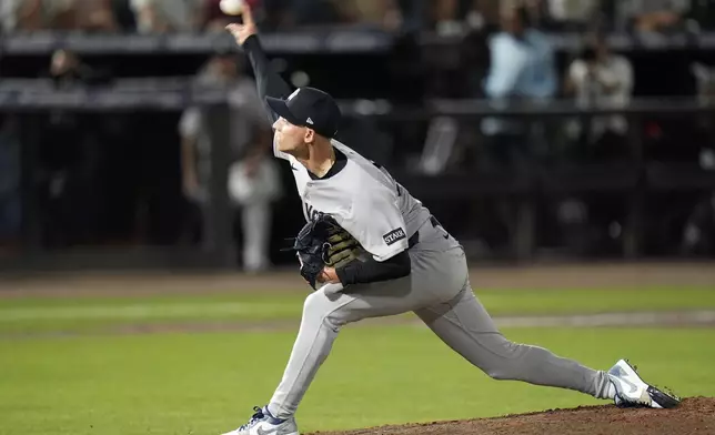 New York Yankees pitcher Luke Weaver delivers to the Tampa Bay Rays during the ninth inning of a baseball game Friday, April 18, 2025, in Tampa, Fla. (AP Photo/Chris O'Meara)