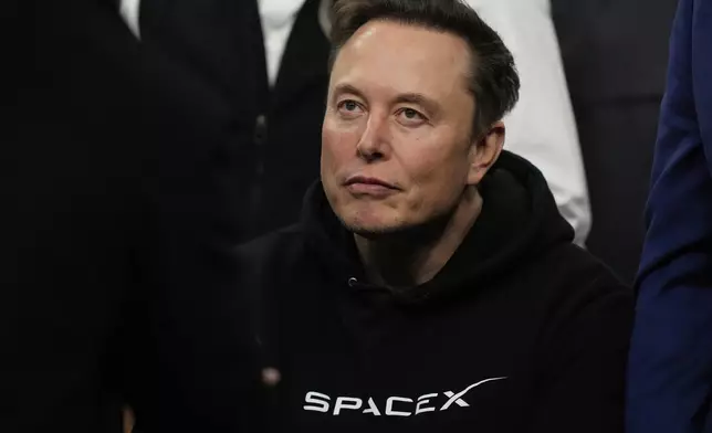 FILE - Elon Musk attends the finals for the NCAA wrestling championship, Saturday, March 22, 2025, in Philadelphia. (AP Photo/Matt Rourke, file)