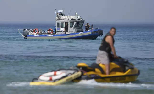Israeli police are looking for a swimmer who they fear was attacked on Monday by a shark, near the Israeli city of Hadera, Tuesday, April 22, 2025. (AP Photo/Ariel Schalit)
