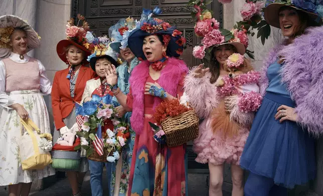 Revelers wearing decorated hats and costumes participate in the annual Easter Parade and Bonnet Festival in front of St. Patrick's Cathedral on Sunday, April 20, 2025, in New York. (AP Photo/Andres Kudacki)
