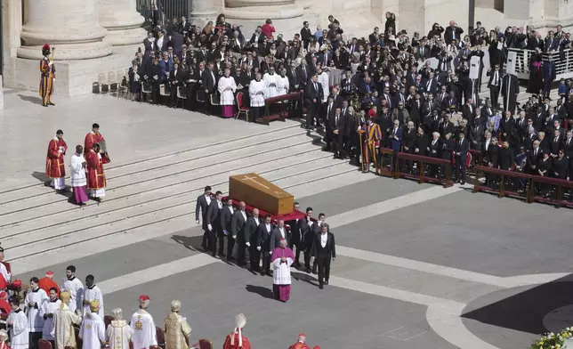 The coffin of Pope Francis is carried into St Peter's Square for his funeral, at the Vatican, Saturday, April 26, 2025. (AP Photo/Markus Schreiber)