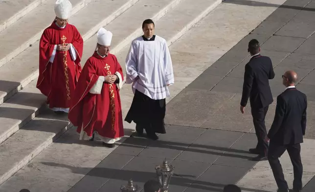 Cardinals arrive to be seated for the funeral of Pope Francis in St. Peter's Square at the Vatican, Saturday, April 26, 2025. (AP Photo/Evan Vucci)