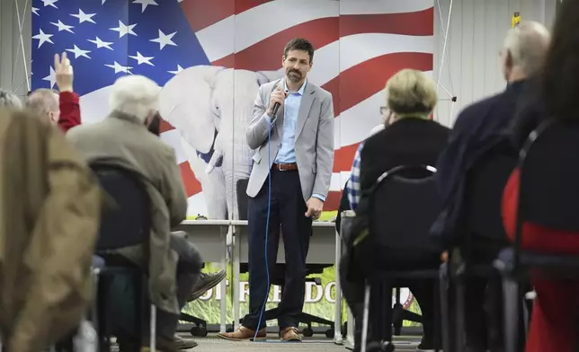 Ryan Kelley listens to a question during his talk at the Jackson County Republican headquarters, Thursday, April 10, 2025, in Jackson, Mich. (AP Photo/Paul Sancya)