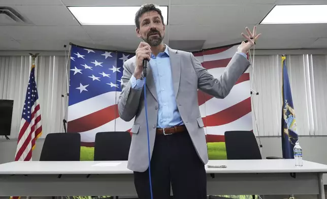 Ryan Kelley speaks at the Jackson County Republican headquarters, Thursday, April 10, 2025, in Jackson, Mich. (AP Photo/Paul Sancya)