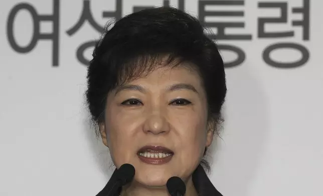 FILE - South Korea's president-elected Park Geun-hye speaks during a press conference at the headquarters of Saenuri Party in Seoul, South Korea, on Dec. 20, 2012. The letters read " Female President." (AP Photo/Ahn Young-joon, File)