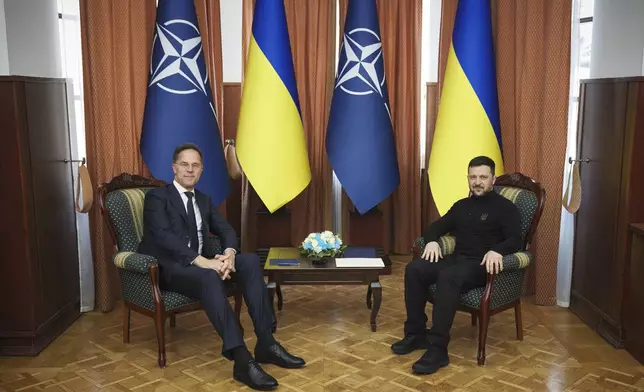 In this photo provided by the Ukrainian Presidential Press Office, NATO Secretary General Mark Rutte and Ukraine's President Volodymyr Zelenskyy pose for a photo during their meeting in Odesa, Ukraine, Tuesday, April 15, 2025.(Ukrainian Presidential Press Office via AP)