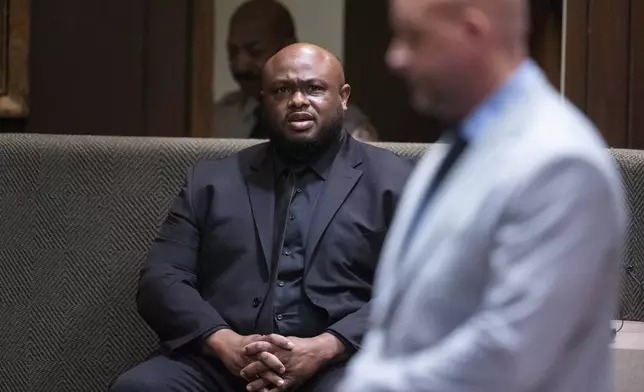 Desmond Mills Jr., a former Memphis Police Department officer who has taken a plea deal, answers a question from Shelby County deputy district attorney Paul Hagerman, right, during the second day of the state trial for the death of Nichols at 201 Poplar in Memphis, Tenn., on Tuesday, April 29, 2025. (Chris Day/Commercial Appeal/USA Today Network via AP, Pool)
