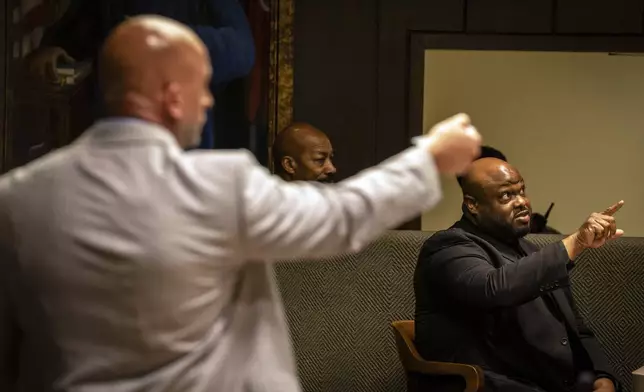 Former Memphis police officer Desmond Mills, right, responds to questions from Shelby County Deputy District Attorney Paul Hagerman, left, during the second day of a trial against former Memphis police officers accused of fatally beating Tyre Nichols in a 2023 traffic stop in Memphis, Tenn., Tuesday, April 29, 2025. (Andrea Morales for MLK50 via AP, Pool)