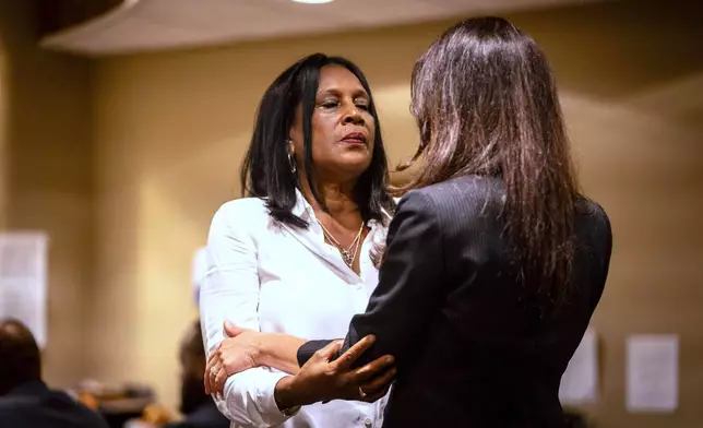 RowVaughn Wells, mother of Tyre Nichols, left, is embraced by a community member while entering the courtroom Tuesday, April 29, 2025, during the second day of a trial against former Memphis police officers accused of fatally beating her son in a 2023 traffic stop in Memphis, Tenn. (Andrea Morales for MLK50 via AP, Pool)