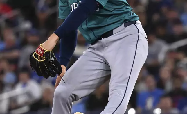 Seattle Mariners starting pitcher Bryan Woo (22) throws to a Toronto Blue Jays batter in the first inning of a baseball game in Toronto on Friday, April 18, 2025. (Jon Blacker/The Canadian Press via AP)