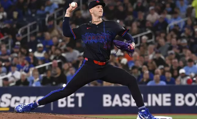 Toronto Blue Jays starting pitcher Bowden Francis (44) throws to a Seattle Mariners batter in the first inning of a baseball game in Toronto on Friday, April 18, 2025. (Jon Blacker/The Canadian Press via AP)
