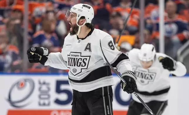 Los Angeles Kings' Drew Doughty (8) celebrates a goal against the Edmonton Oilers during the second period of an NHL hockey playoff game in Edmonton, Alberta, Friday, April 25, 2025. (Jason Franson/The Canadian Press via AP)