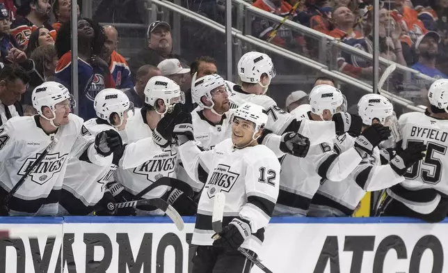 Los Angeles Kings' Trevor Moore (12) celebrates a goal against the Edmonton Oilers during the second period of an NHL hockey playoff game in Edmonton, Alberta, Friday, April 25, 2025. (Jason Franson/The Canadian Press via AP)