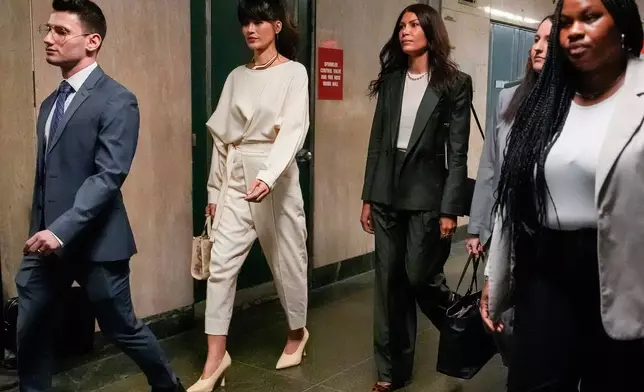 Tarale Wulff, second from left, Dawn Dunning, third from left, and attorney Lindsay Goldbrum, second from right, arrive for Harvey Weinstein's retrial at Manhattan criminal court, Wednesday, April 23, 2025, in New York. (AP Photo/Julia Demaree Nikhinson)