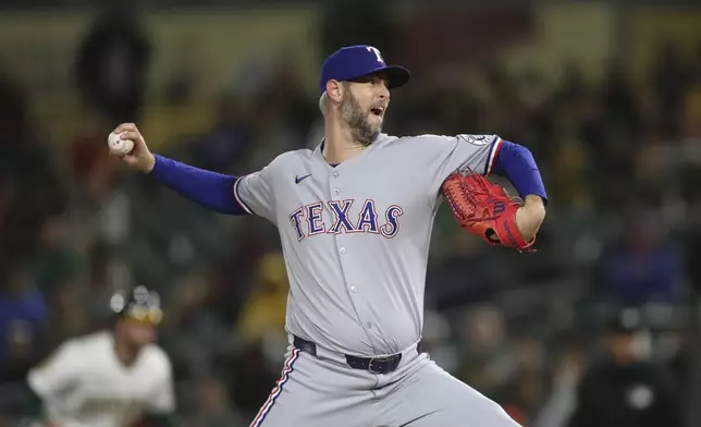 Texas Rangers pitcher Chris Martin (55) throws a pitch to an Athletics batter during the seventh inning of a baseball game Thursday, April 24, 2025, in West Sacramento, Calif. (AP Photo/Scott Marshall)