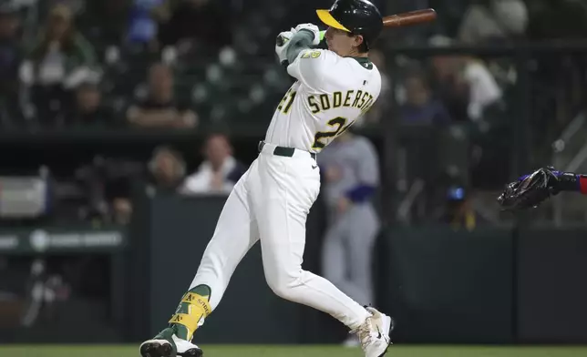Athletics Tyler Soderstrom hits a single against the Texas Rangers during the sixth inning of a baseball game Thursday, April 24, 2025, in West Sacramento, Calif. (AP Photo/Scott Marshall)