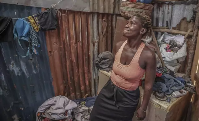 Zainab Sakoteh sits in her room where she brings her clients for sex work that funds her Kush habit in Freetown, Sierra Leone, Thursday, March 13, 2025. (AP Photo/Caitlin Kelly)
