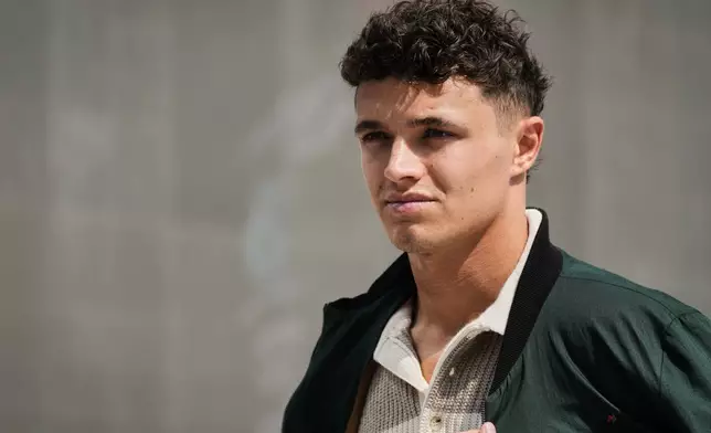 McLaren driver Lando Norris of Britain walks through the paddock ahead of the Formula One Saudi Arabian Grand Prix at the Jeddah Corniche Circuit in Jeddah, Saudi Arabia, Thursday, April 17, 2025. (AP Photo/Darko Bandic)