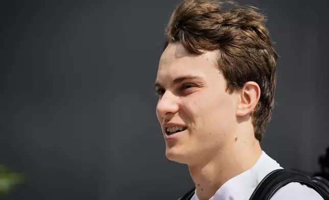McLaren driver Oscar Piastri of Australia walks through the paddock ahead of the Formula One Saudi Arabian Grand Prix at the Jeddah Corniche Circuit in Jeddah, Saudi Arabia, Thursday, April 17, 2025. (AP Photo/Darko Bandic)