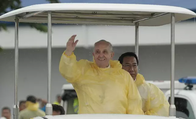 FILE - Pope Francis waves to the faithful on his arrival in Tacloban, Philippines, Jan. 17, 2015. (AP Photo/Wally Santana, File)